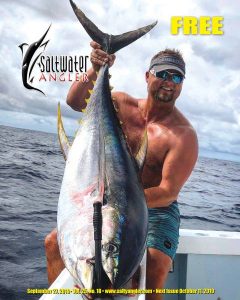 Capt. Adam Doelle with a 125 pound Yellowfin Tuna