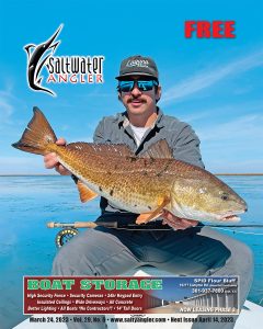 Capt. Justin Jordan of Lotus Guide Service with a beautiful bull red caught on the fly in the back marshes of Galveston.