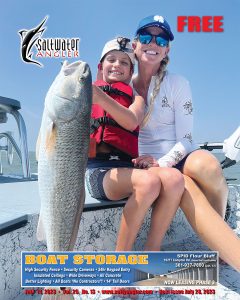 Keegan Rowe and his mother Codie are proud of this 27" redfish he caught along some oysters reefs in Dead Man's Hole with Capt. Joey Farah.