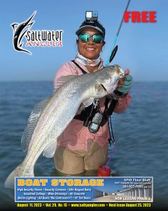 Capt. Reanna DeLaCruz with a 32", 9lb trout caught in Baffin Bay on a Texas Custom Lure Night Stalker Top Water.