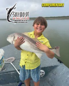 Kain Myakishev with a hefty redfish in Corpus Christi caught with live shrimp